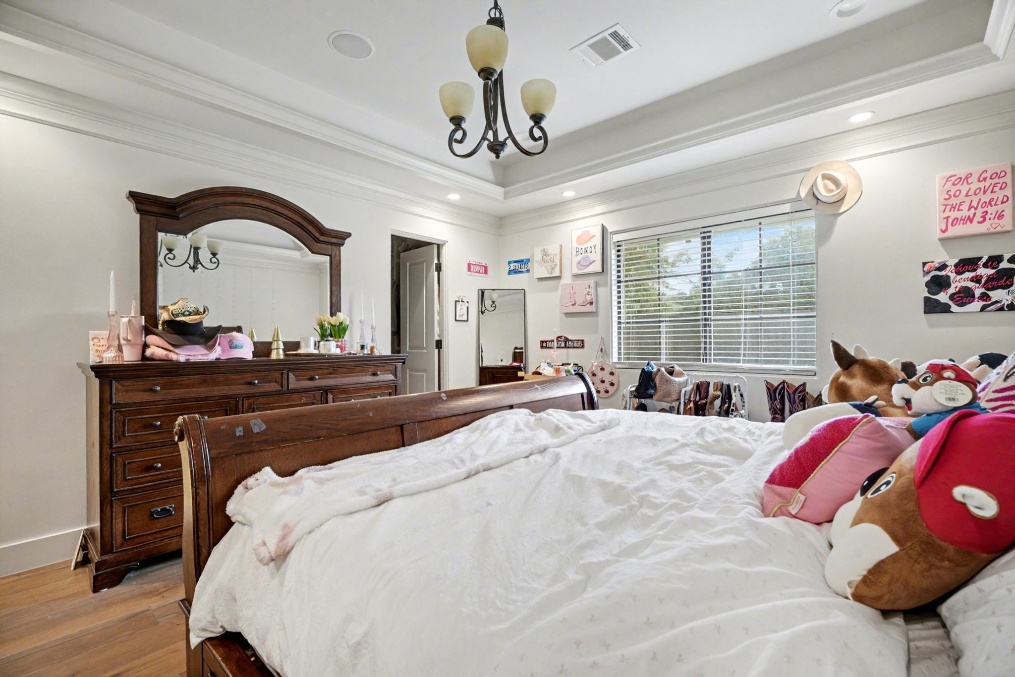 8515 Edgemoor Drive Houston, TX 77036 - Photo 20 of 33 a bedroom with a bed and a dresser
