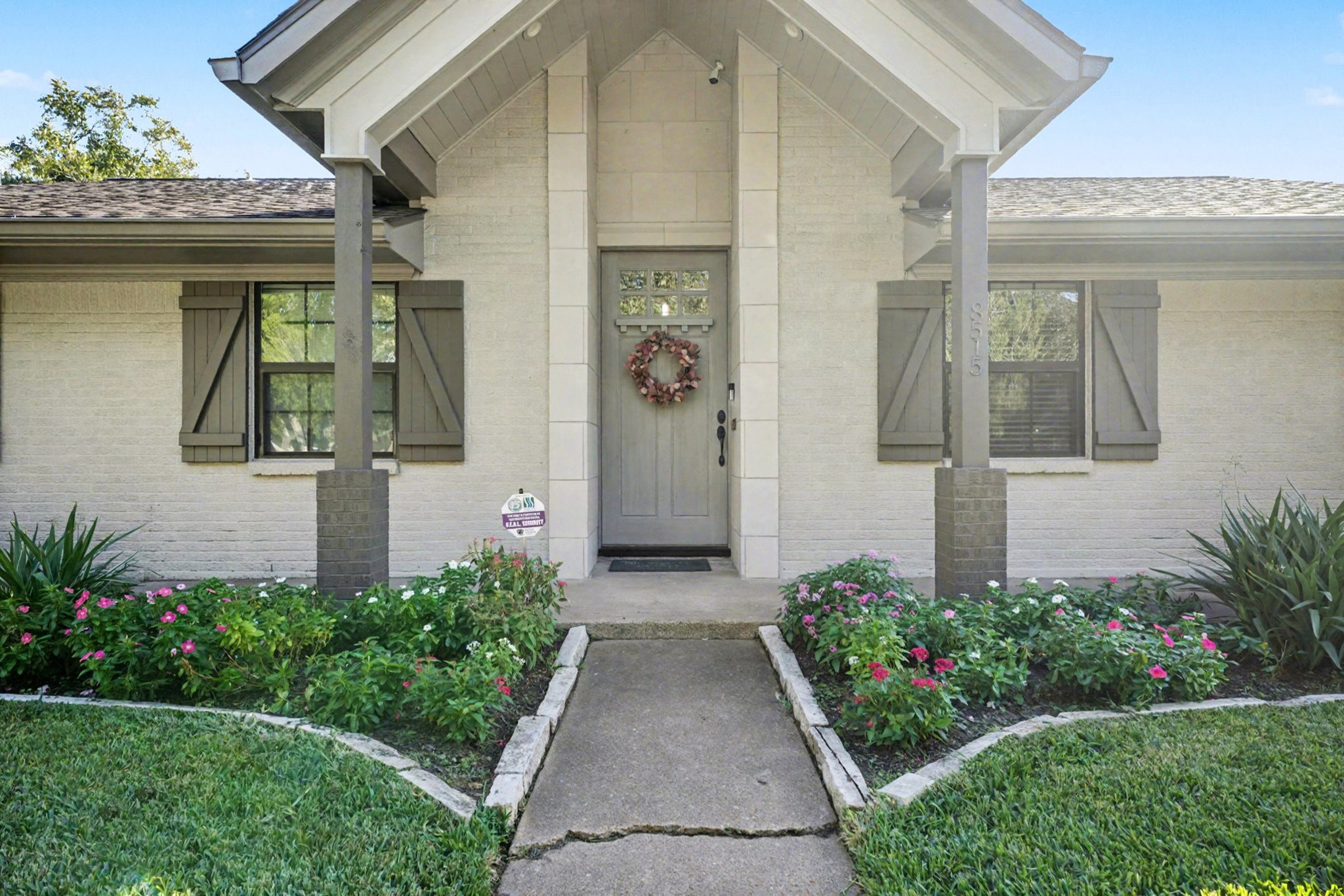 8515 Edgemoor Drive Houston, TX 77036 - Photo 2 of 33 a front view of a house with garden