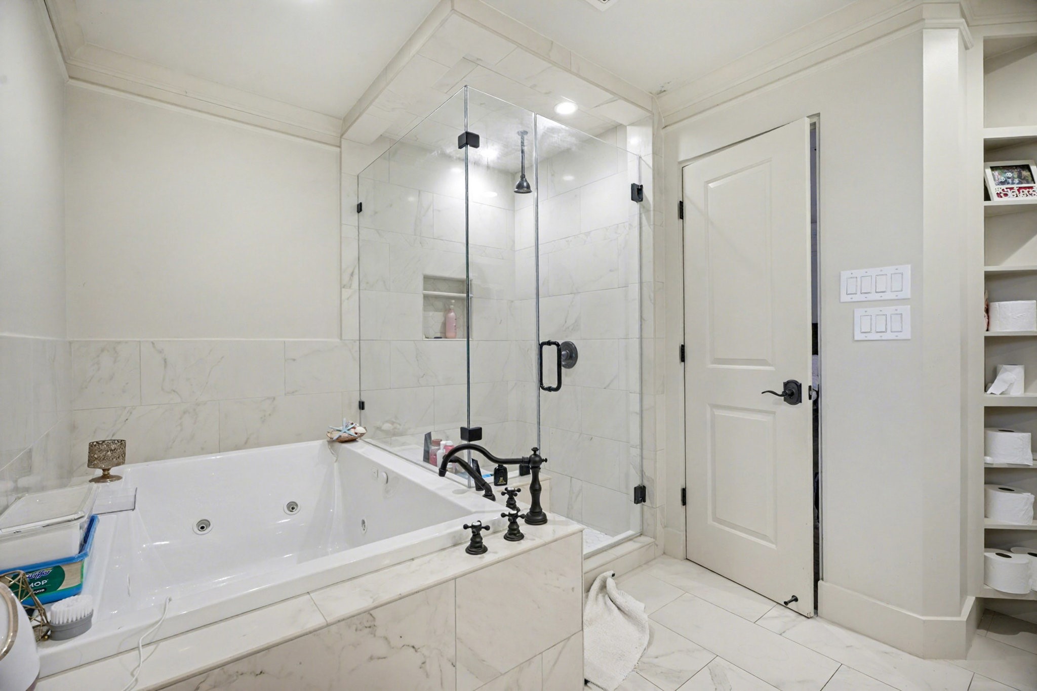 8515 Edgemoor Drive Houston, TX 77036 - Photo 22 of 33 a bathroom with a bathtub and a shower