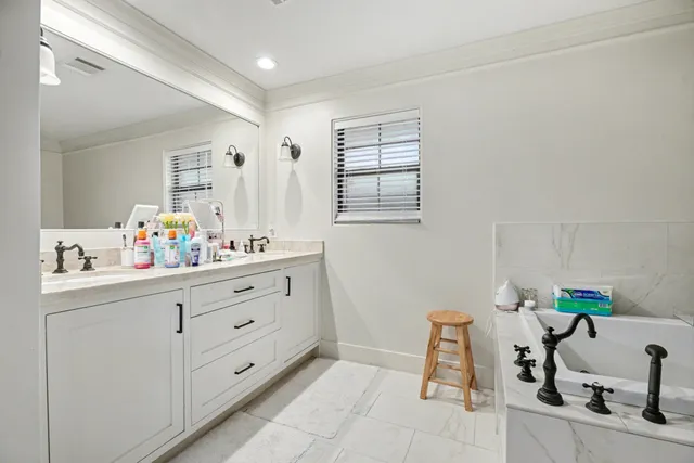 a bathroom with a sink and a window