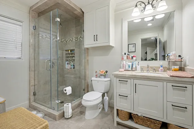 a spacious bathroom with a sink a toilet and shower
