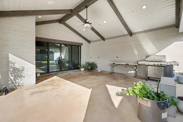a lobby with furniture and a potted plant