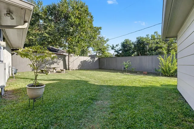 a view of a backyard of the house