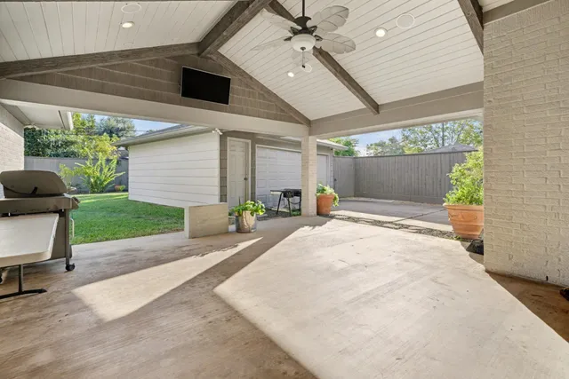 a house with yard and a potted plant