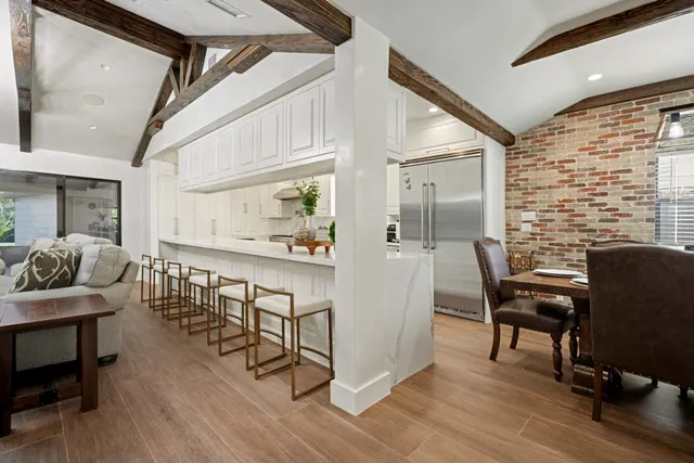 a view of a livingroom with furniture and a window