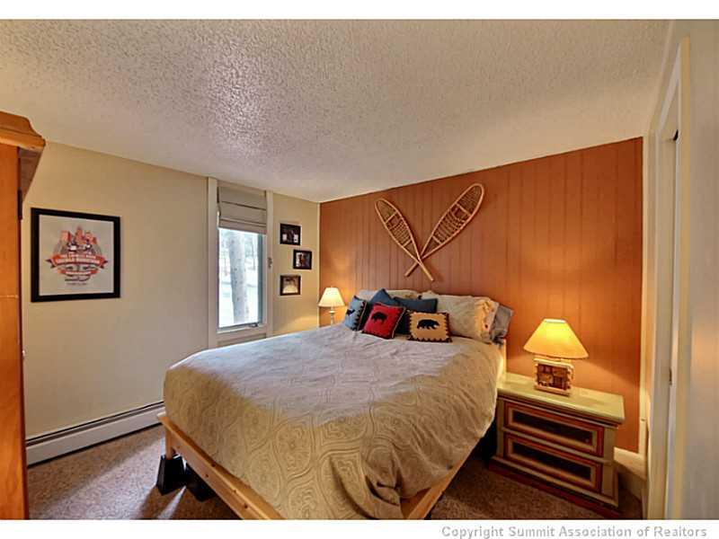1100 Ski Hill Road, Unit 36 Breckenridge, CO 80424 - Photo 11 of 17 a bedroom with a bed and a window