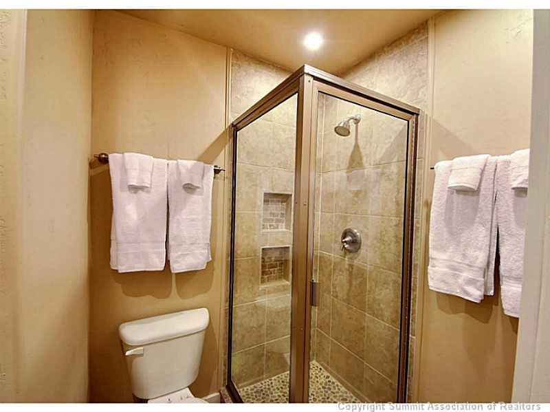 1100 Ski Hill Road, Unit 36 Breckenridge, CO 80424 - Photo 13 of 17 a bathroom with a shower and toilet