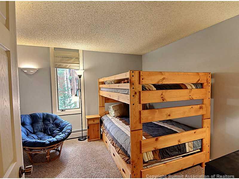 1100 Ski Hill Road, Unit 36 Breckenridge, CO 80424 - Photo 16 of 17 a bedroom with a bed and a window