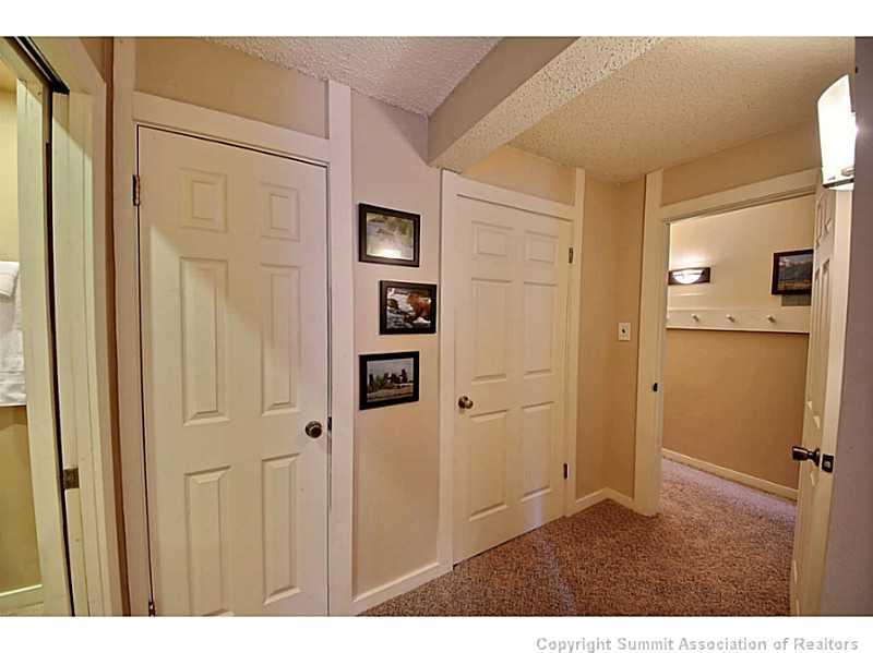 1100 Ski Hill Road, Unit 36 Breckenridge, CO 80424 - Photo 17 of 17 a view of a kitchen with white cabinets