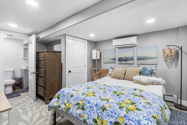 a bedroom with a bed and a couch