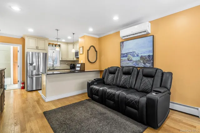 a living room with furniture fireplace and a table