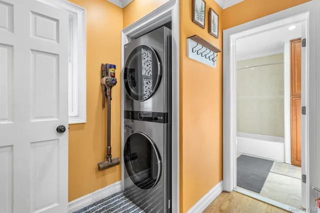 a bathroom with a bathtub shower sink vanity and toilet