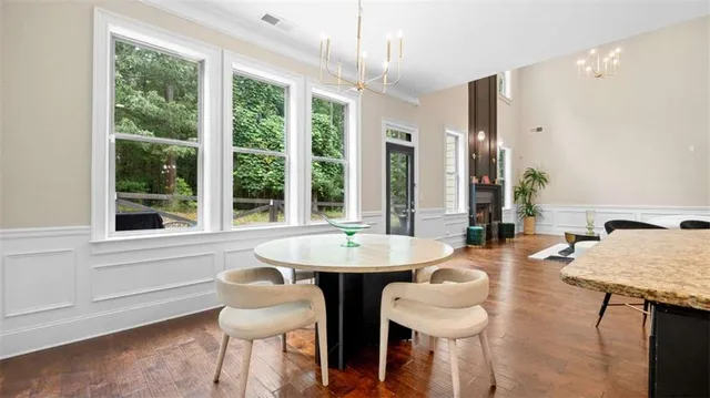a dining room with furniture and window