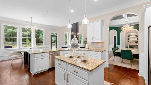 a living room with granite countertop kitchen island furniture and a large window