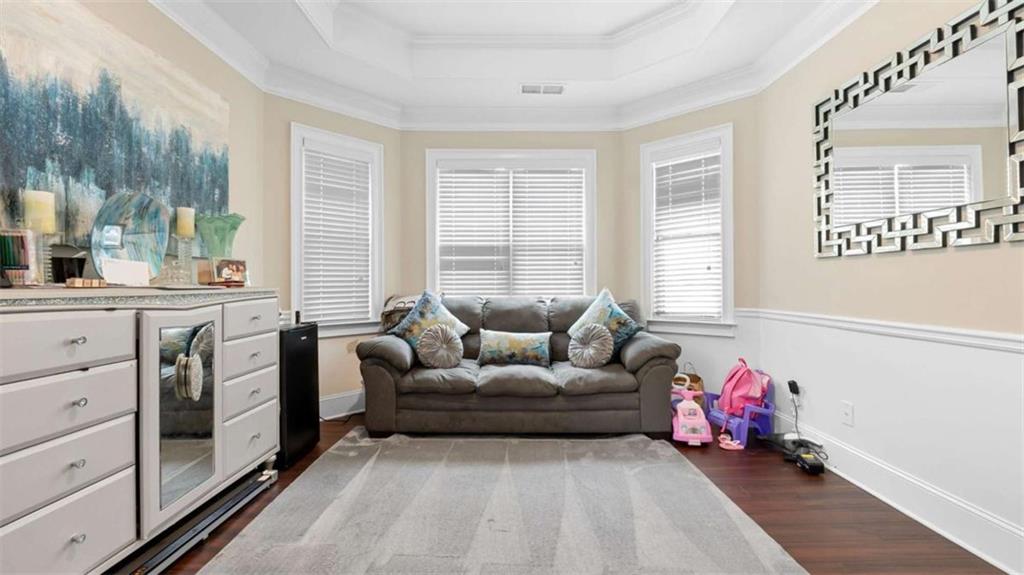 2328 Austin Common Way Dacula, GA 30019 - Photo 21 of 52 a living room with furniture and a window