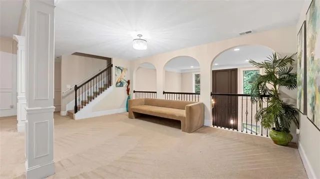 a view of a hallway with staircase