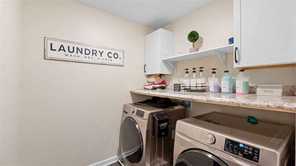 2328 Austin Common Way Dacula, GA 30019 - Photo 32 of 52 a utility room with dryer and washer