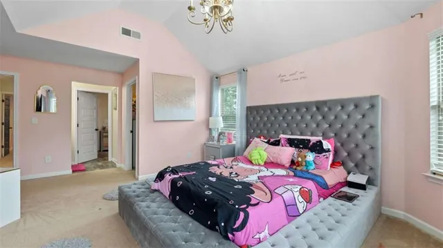 a utility room with fridge and wall