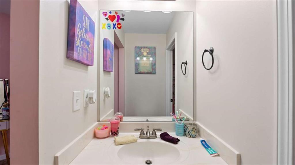 2328 Austin Common Way Dacula, GA 30019 - Photo 42 of 52 a bathroom with a sink and a mirror