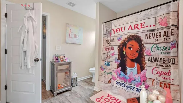 a bedroom with bed and a window