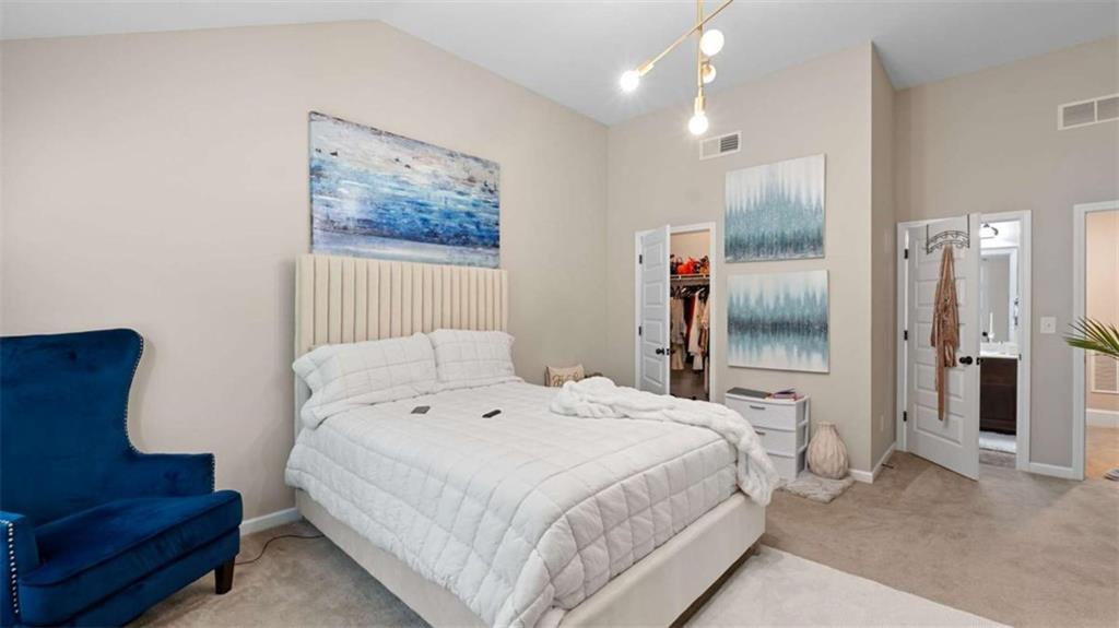 2328 Austin Common Way Dacula, GA 30019 - Photo 49 of 52 a bedroom with a bed and a couch