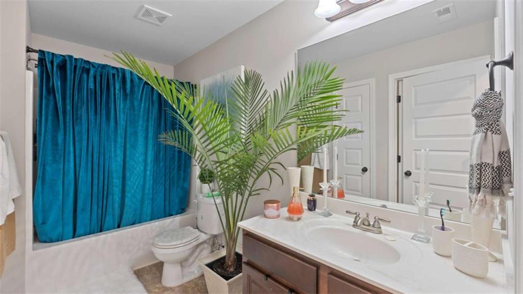 2328 Austin Common Way Dacula, GA 30019 - Photo 50 of 52 a bathroom with a sink and a mirror