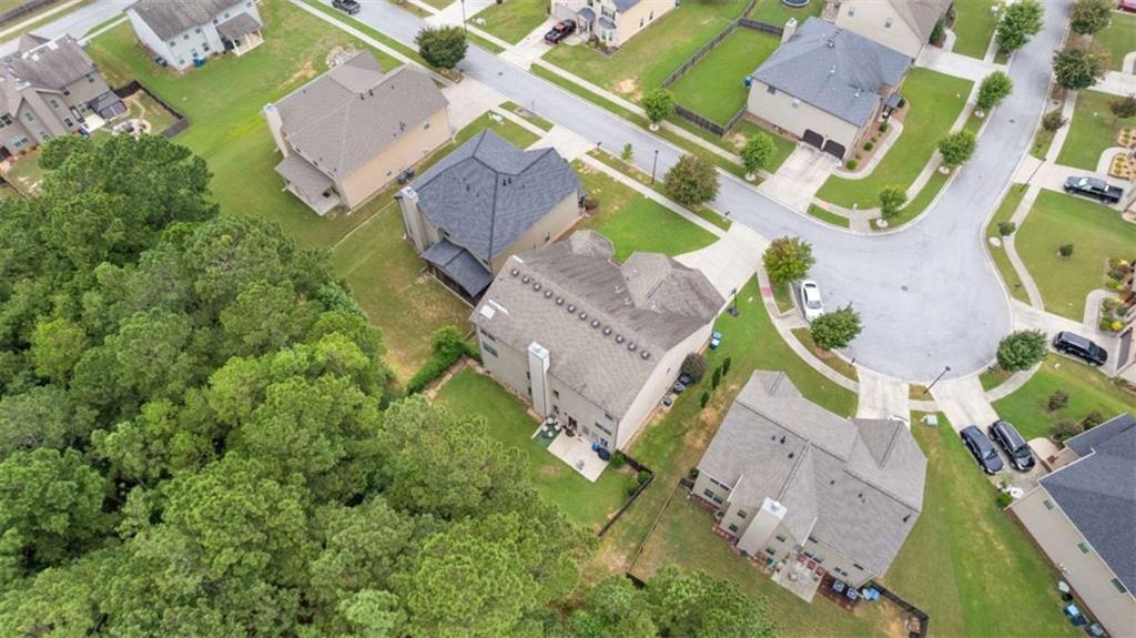2328 Austin Common Way Dacula, GA 30019 - Photo 5 of 52 an aerial view of residential houses with outdoor space