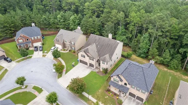 an aerial view of a house with outdoor space