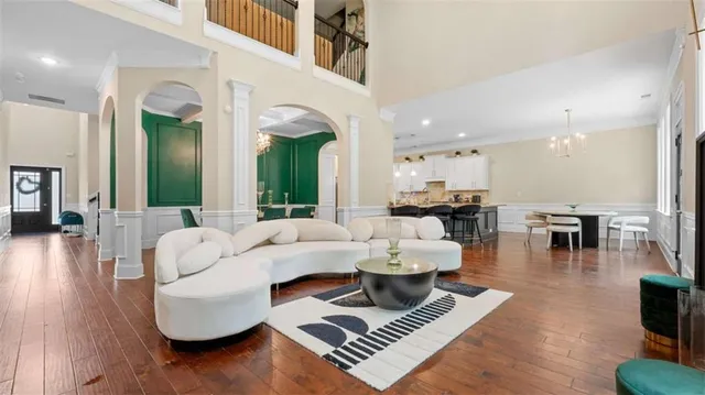 a living room with fireplace furniture and a large window