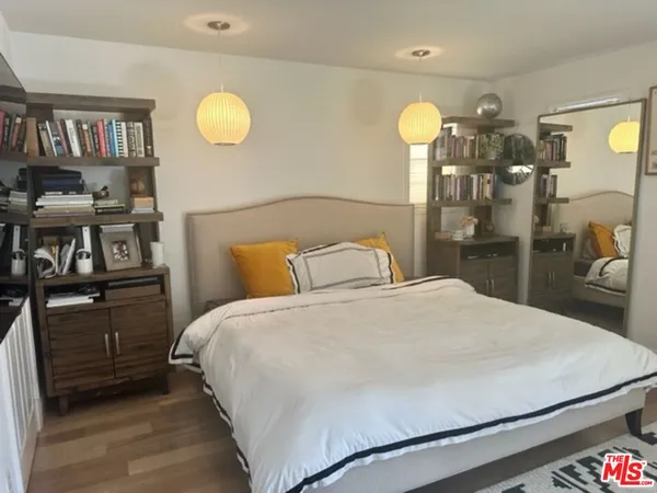 a bedroom with a bed and closet