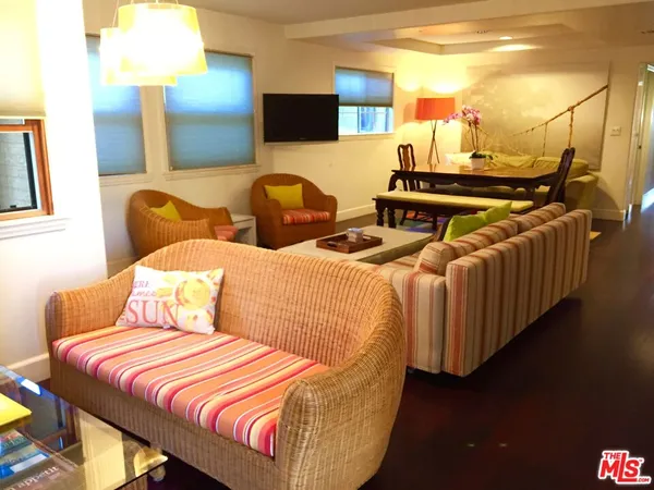 a bedroom with two beds and painted walls