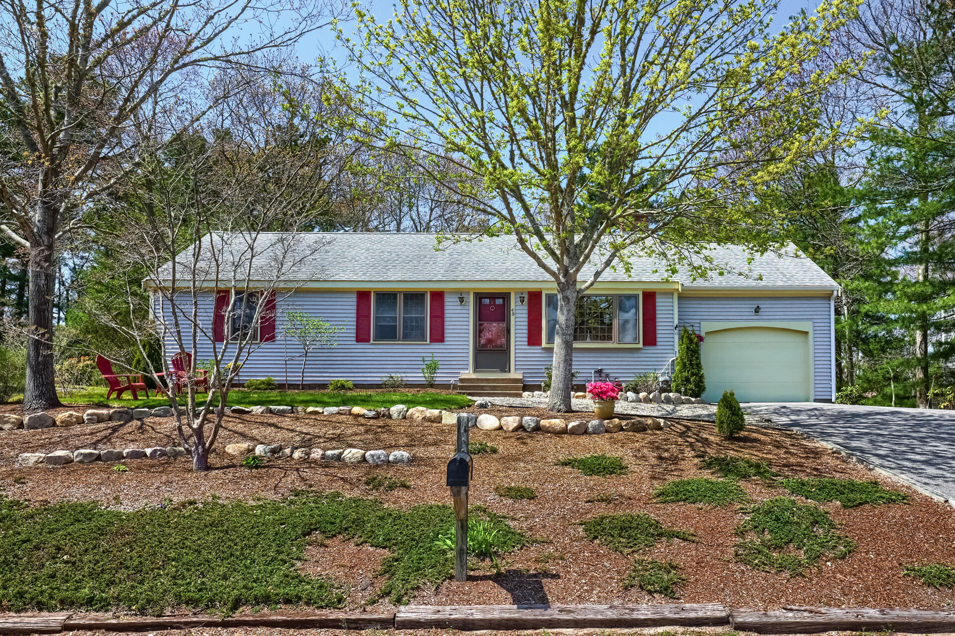 48 Gunstock Road Osterville, MA 02655 - Photo 1 of 28 a front view of a house with garden