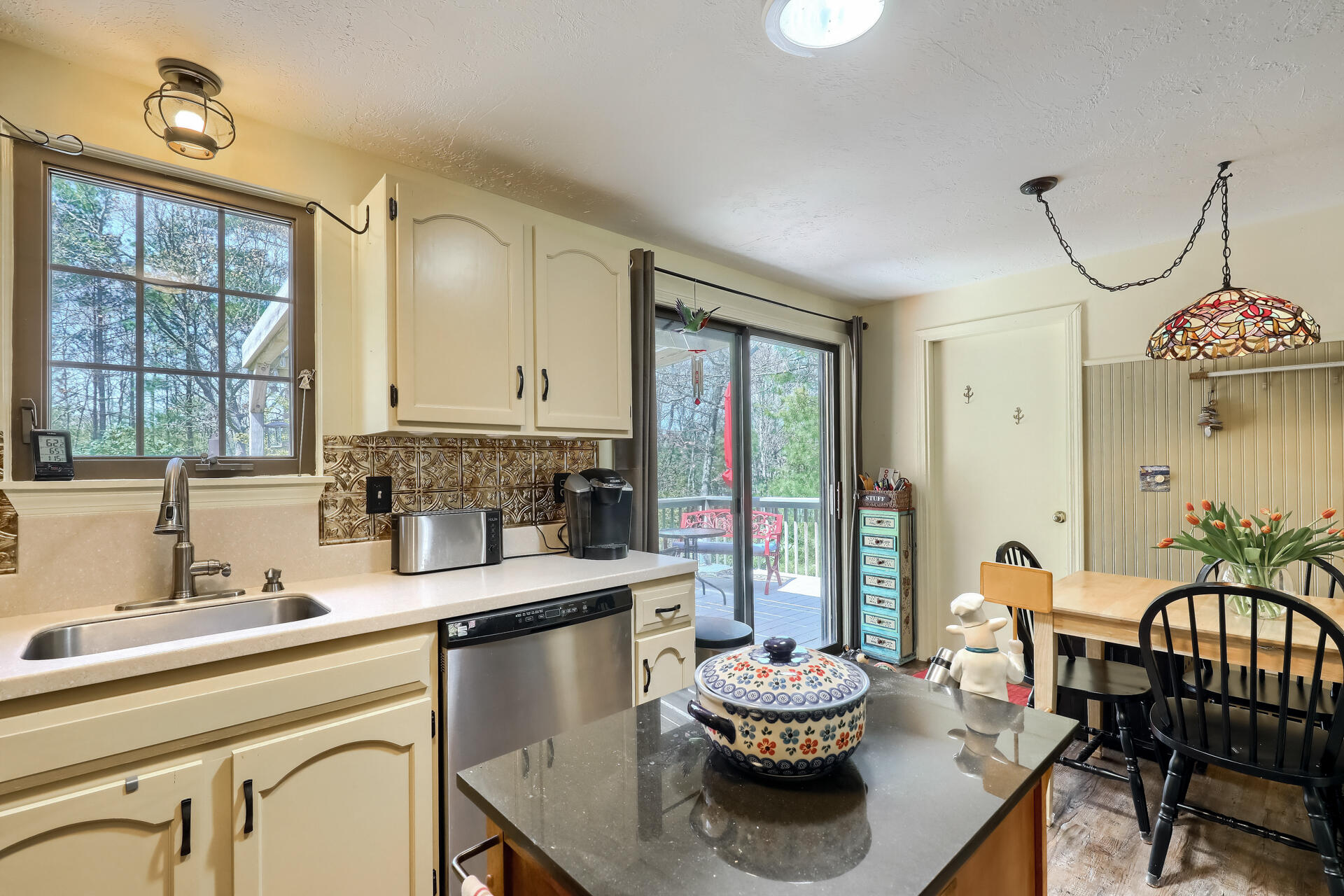 48 Gunstock Road Osterville, MA 02655 - Photo 11 of 28 a kitchen with a table and chairs in it