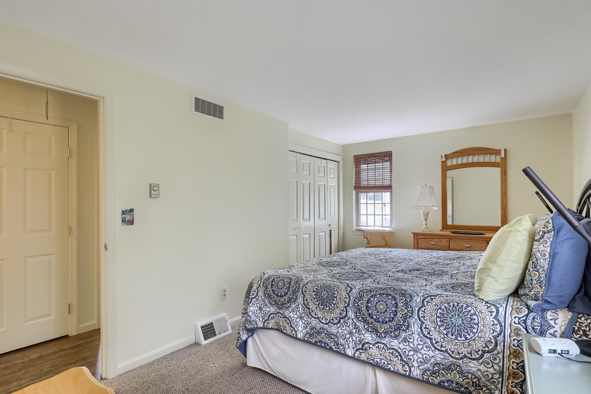 48 Gunstock Road Osterville, MA 02655 - Photo 16 of 28 a bedroom with a large bed and wooden floor