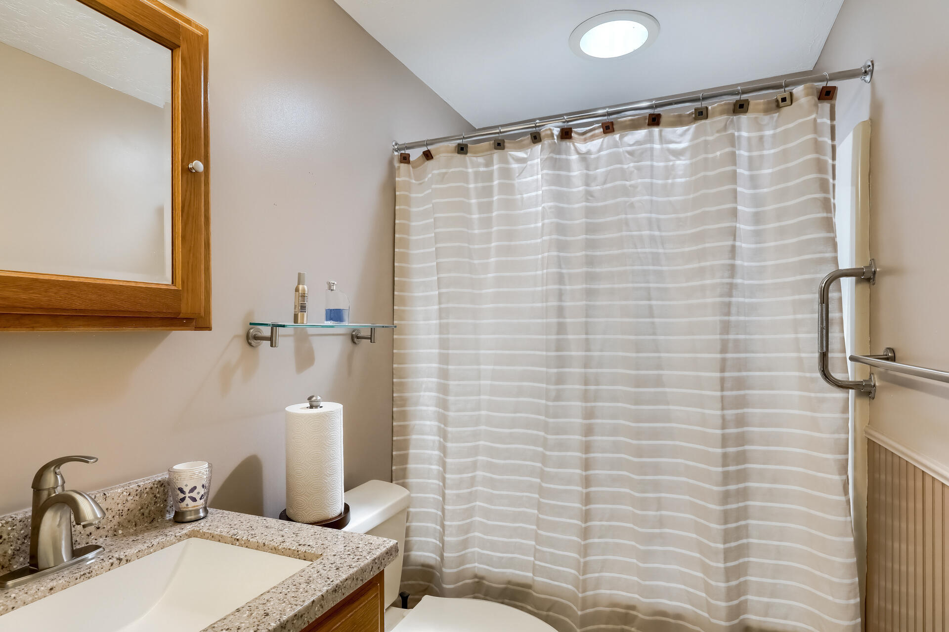 48 Gunstock Road Osterville, MA 02655 - Photo 18 of 28 a bathroom with a sink a toilet and shower curtain
