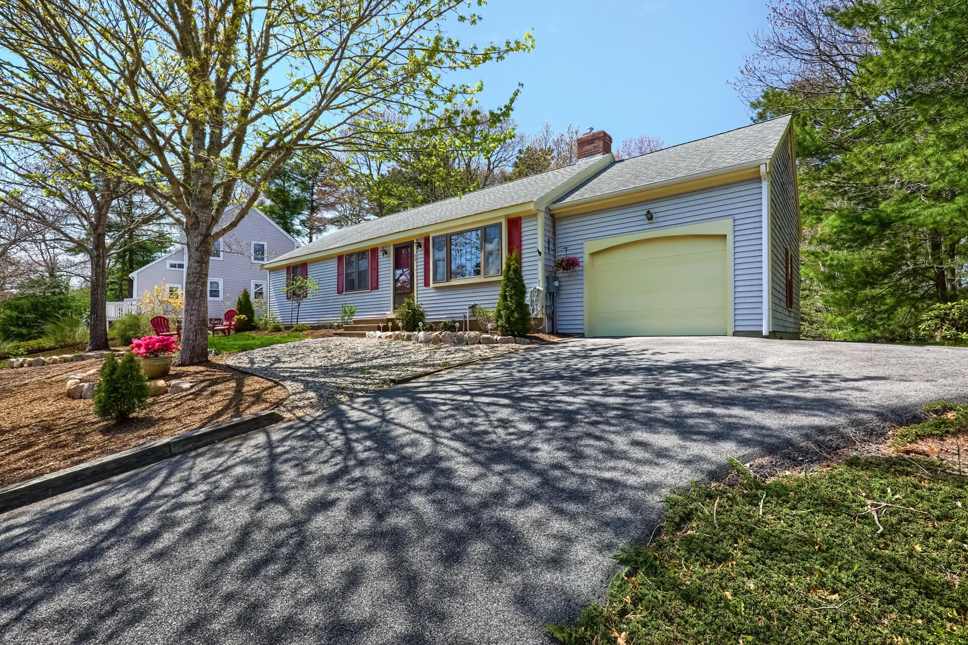 48 Gunstock Road Osterville, MA 02655 - Photo 2 of 28 a front view of a house with a yard