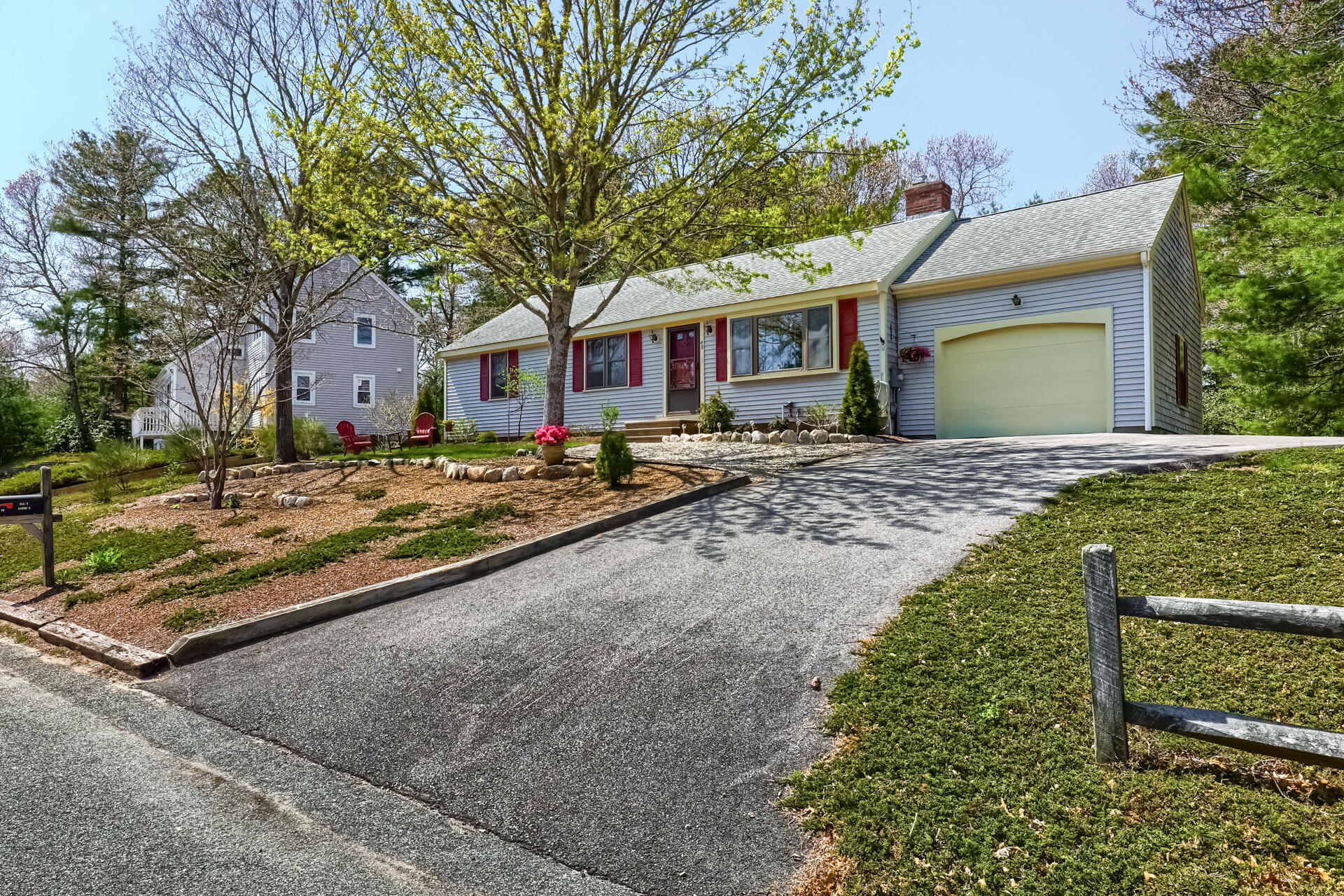 48 Gunstock Road Osterville, MA 02655 - Photo 4 of 28 a front view of a house with a yard