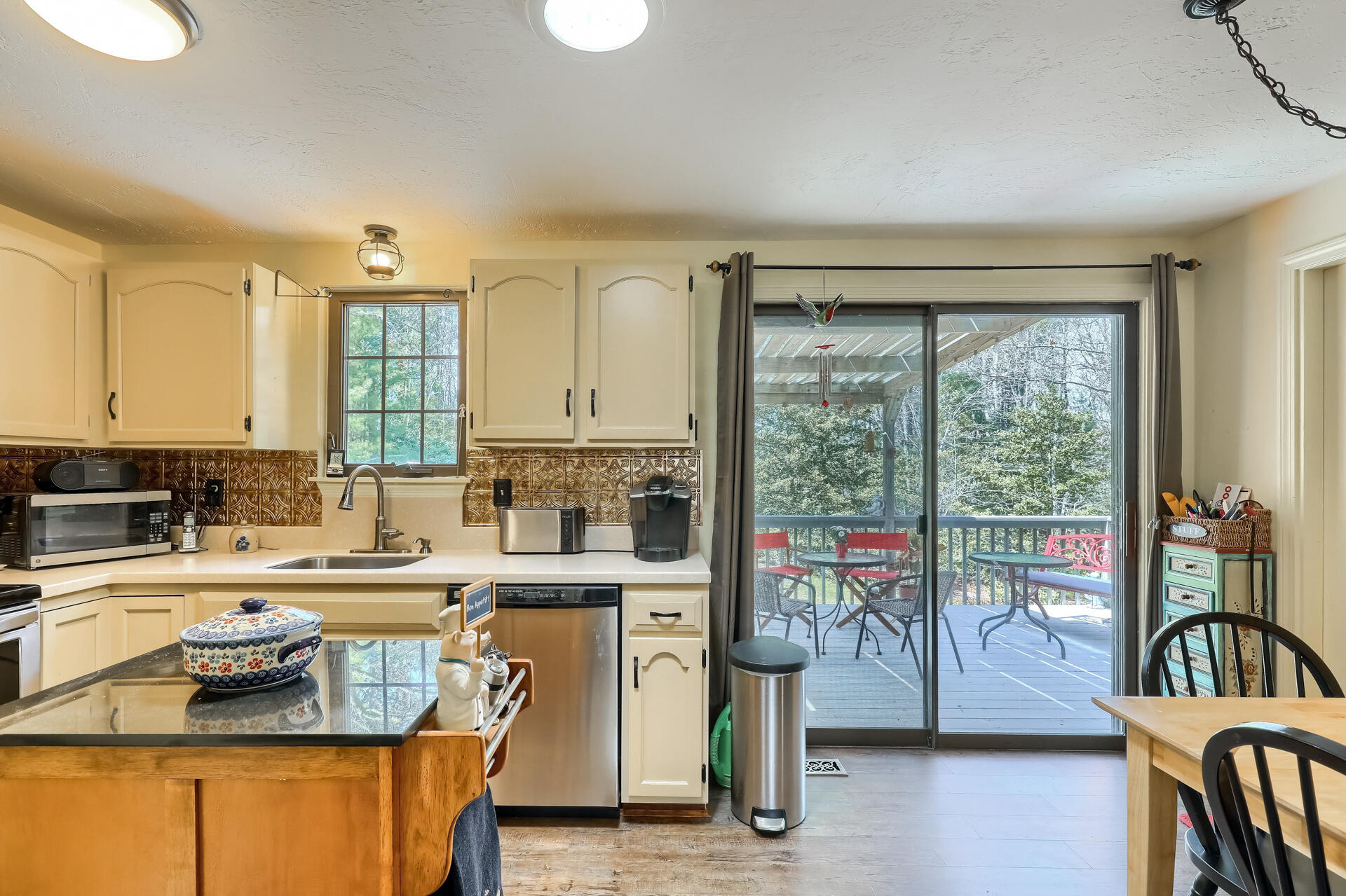 48 Gunstock Road Osterville, MA 02655 - Photo 9 of 28 a kitchen with a stove a sink and a refrigerator