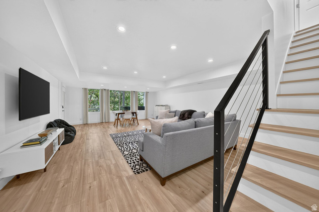 1979 Cave Hollow Way Bountiful, UT 84010 - Photo 31 of 59 Open-concept living space featuring wood-finish flooring, recessed lighting, and a modern staircase with cable railing