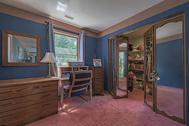 a view of room with furniture and windows