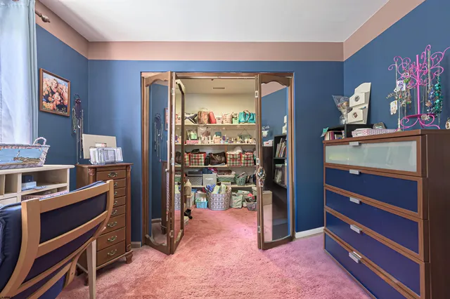 a view of room with furniture and closet