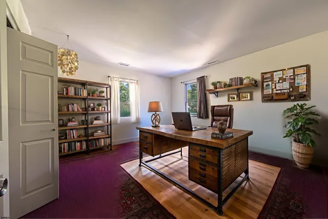 a view of a workspace with furniture