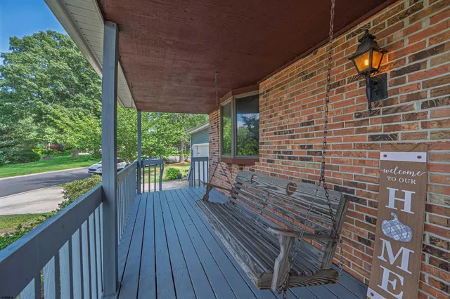 a view of a balcony with wooden floor
