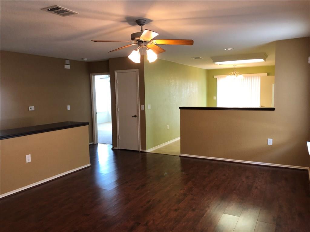 6912 Walkup Lane Austin, TX 78747 - Photo 14 of 14 a view of an empty room with wooden floor and a window