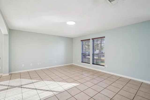 a view of an empty room and window