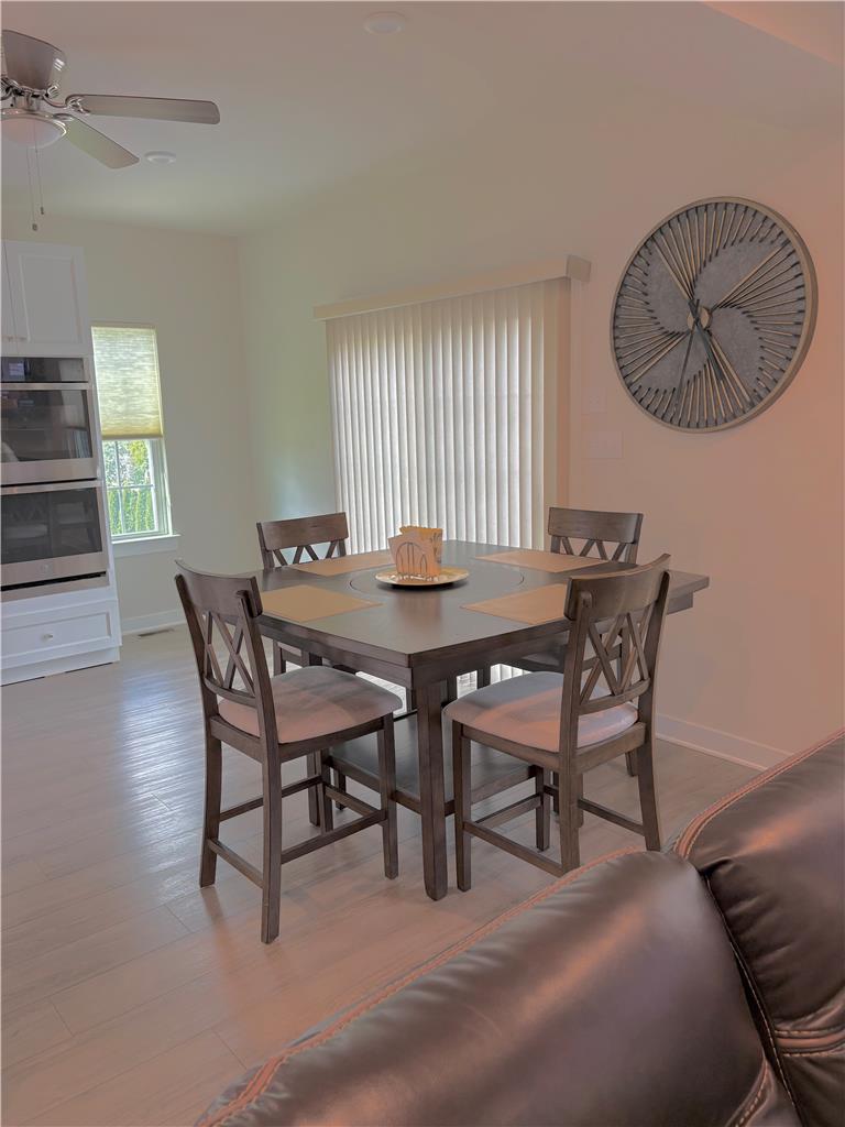 3951 Trythall Street Bethlehem, PA 18020 - Photo 6 of 15 A well-lit dining area offers a seamless flow into the kitchen, ideal for entertaining.