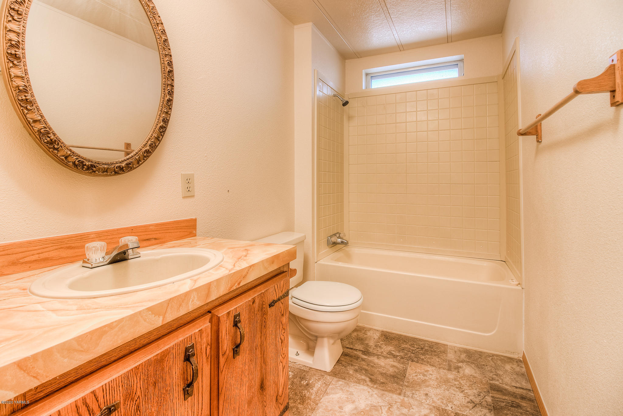 3641 Independence Road Sunnyside, WA 98944 - Photo 12 of 21 a bathroom with a sink a toilet and a mirror