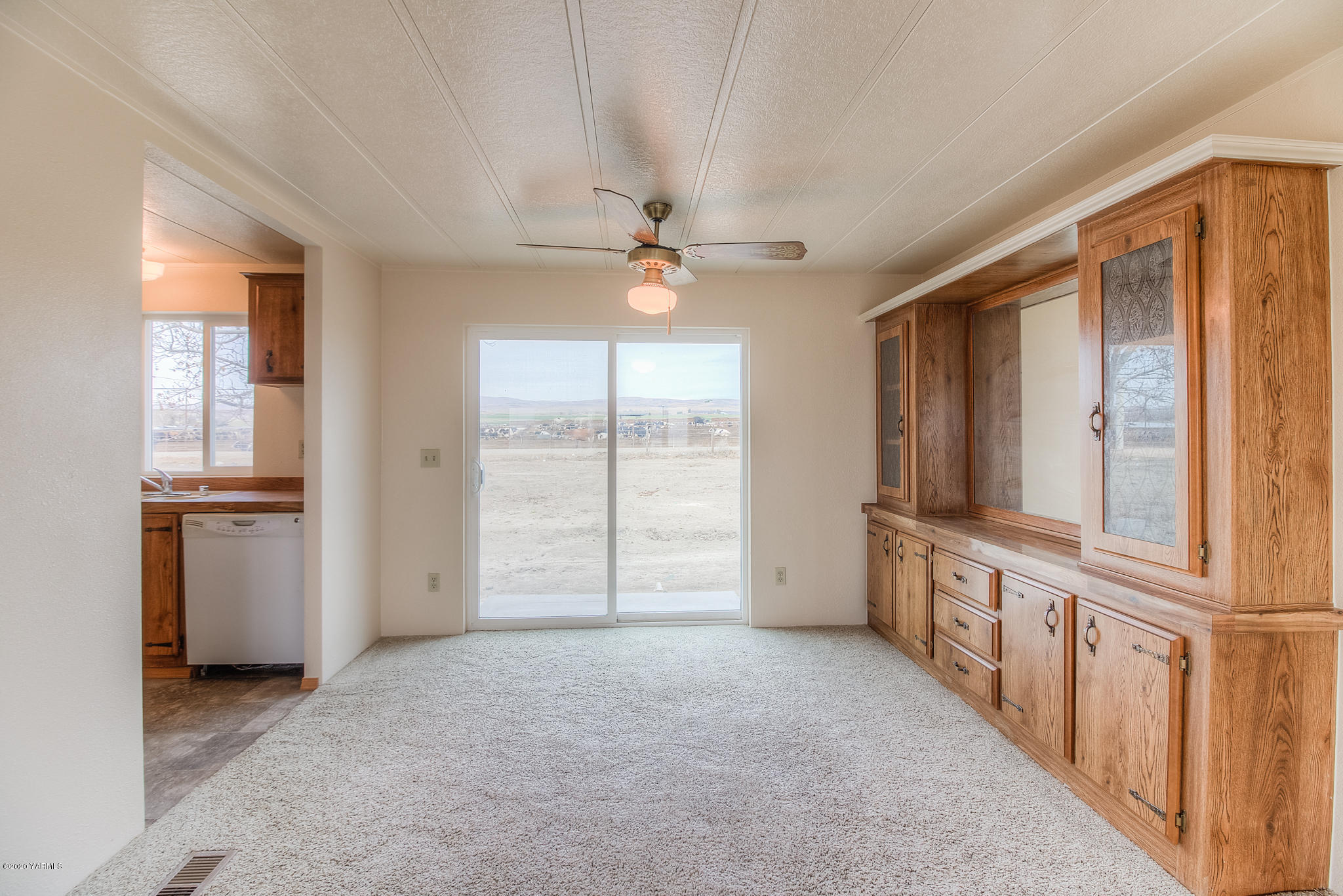 3641 Independence Road Sunnyside, WA 98944 - Photo 3 of 21 wooden floor in an empty room with a window