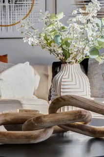 a vase of flowers sitting on a table