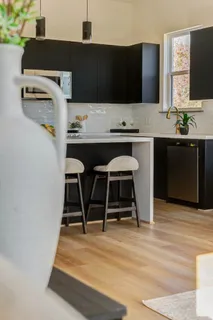 a kitchen with a table and chairs in it